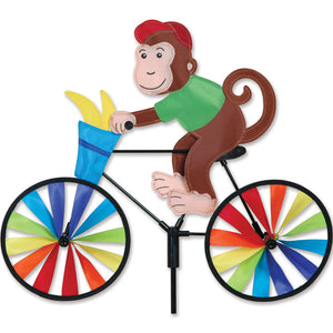 Vire-vent singe à vélo