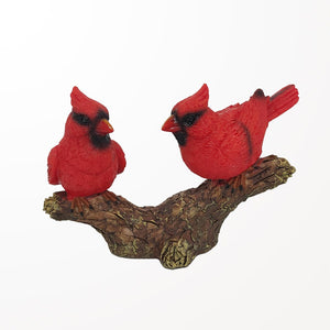 Figurine cardinal sur une branche