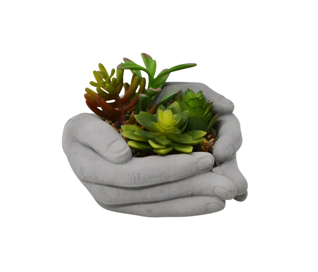 Plante artificielle dans mains